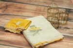 Graceful Off-White Saree with Yellow Blouse