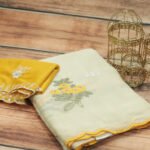 Graceful Off-White Saree with Yellow Blouse